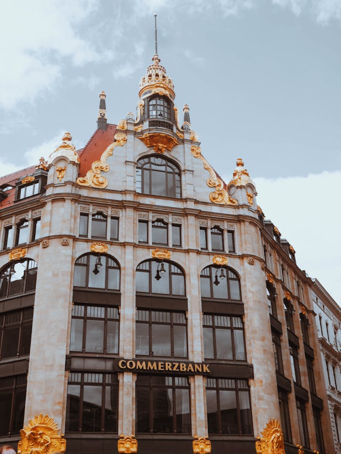Low angle view of the ornate Commerzbank building's facade with baroque architecture in Germany.